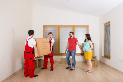 Careful box packing in a Limehouse apartment building
