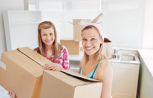 Professional removals team planning a move in Limehouse near East London streets